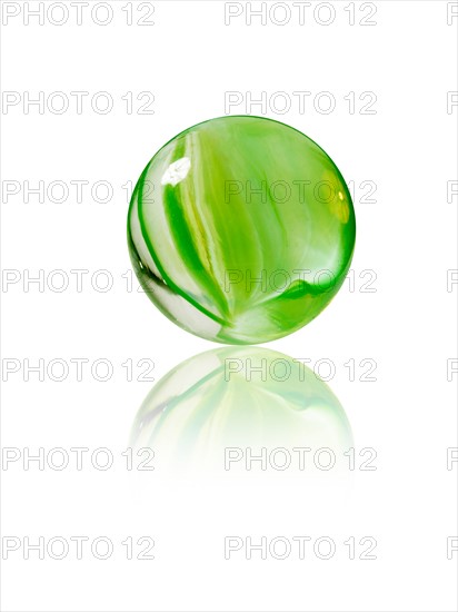 Studio shot of green marbles arranged in Exclamation Point. Photo : David Arky