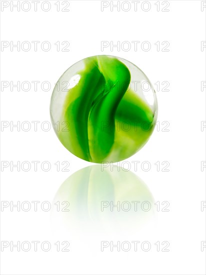 Studio shot of green marbles arranged in Exclamation Point. Photo : David Arky