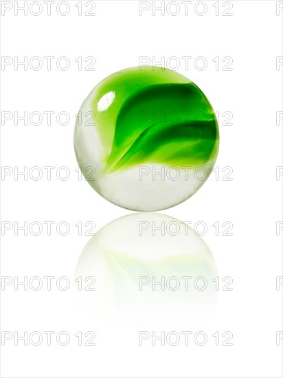 Studio shot of green marbles arranged in Exclamation Point. Photo : David Arky