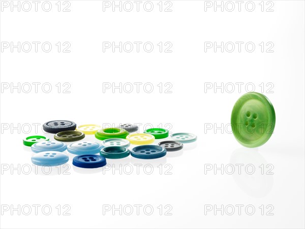 Studio shot of green marbles arranged in Exclamation Point. Photo : David Arky