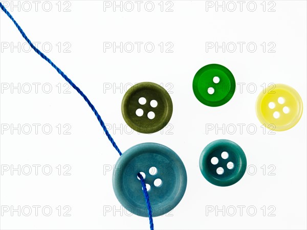 Studio shot of green marbles arranged in Exclamation Point. Photo : David Arky