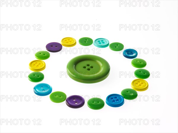 Studio shot of multi colored buttons arranged in circle. Photo : David Arky