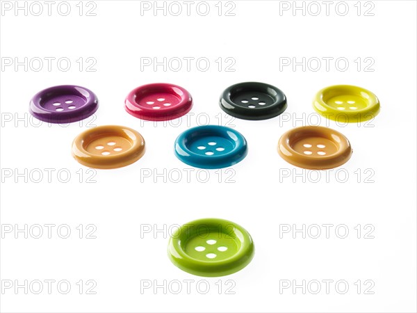 Studio shot of medium group of multi colored buttons. Photo : David Arky