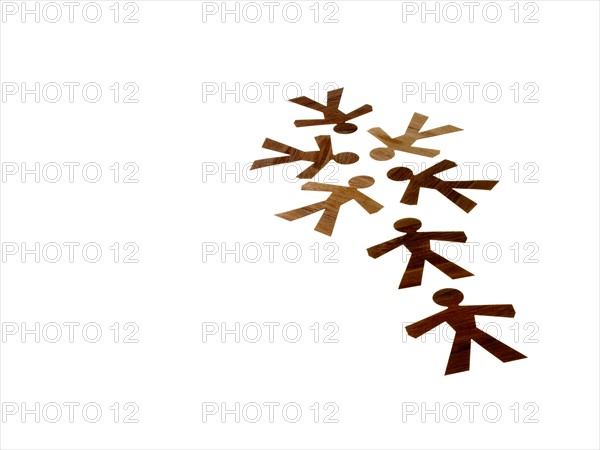 Studio shot of wood grain people paper chain. Photo : David Arky