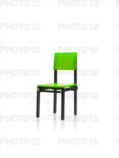 Studio shot of single green chair. Photo : David Arky