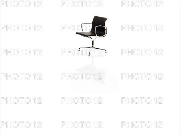 Single corporate chair on white background. Photo : David Arky