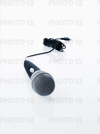 Studio shot of microphone and microphone cable on white background. Photo : David Arky