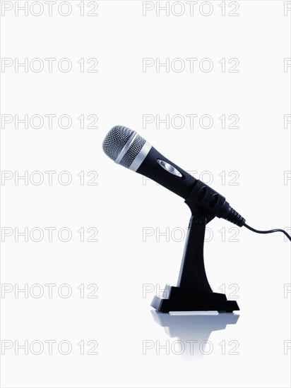 Studio shot of microphone on white background. Photo : David Arky