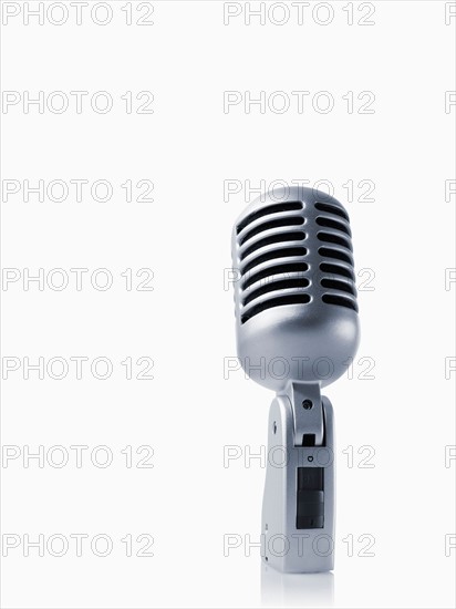 Studio shot of vintage-themed modern microphone on white background. Photo : David Arky