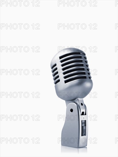 Studio shot of vintage-themed modern microphone on white background. Photo : David Arky