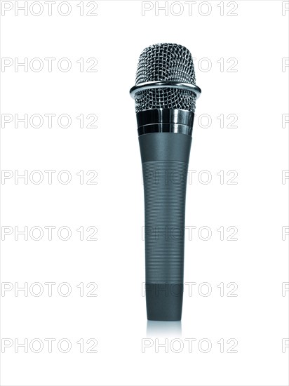 Studio shot of microphone on white background. Photo : David Arky