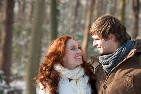 Netherlands, North-Brabant, Hilvarenbeek. Young couple embracing in winter scenery. Photo : Jan Scherders