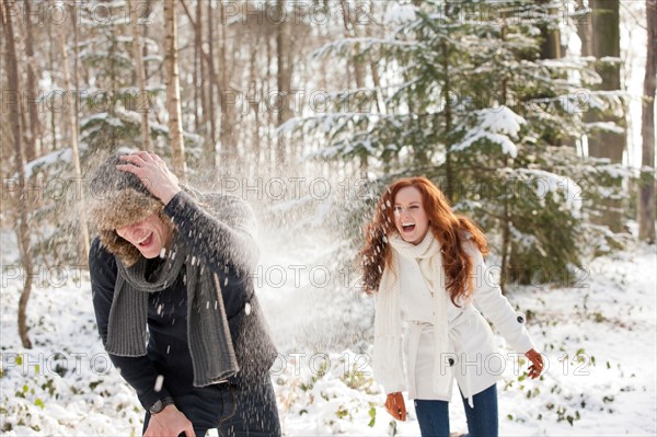 Netherlands, North-Brabant, Hilvarenbeek. Young couple are having snowball fight. Photo : Jan Scherders