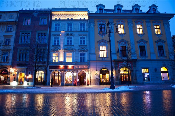 Poland, Krakow. Historic houses in main Square. Photo : Henryk Sadura