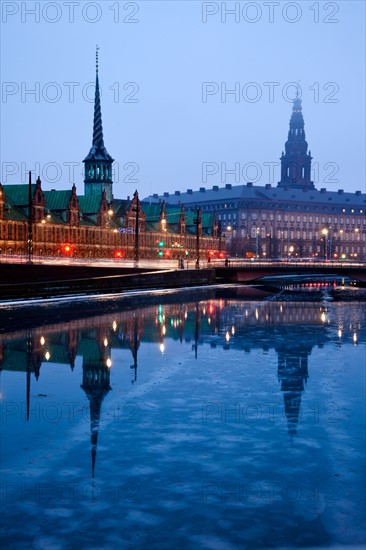 Denmark, Copenhagen. View over canal towards Copenhagen Stock Exchange and Christiansborg Castle. Photo : Henryk Sadura