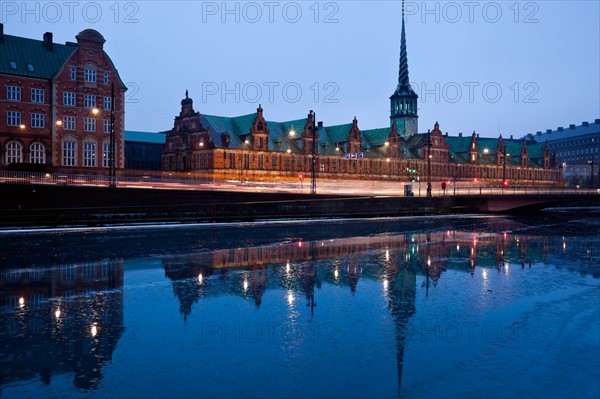 Denmark, Copenhagen. View over canal towards Copenhagen Stock Exchange and Christiansborg Castle. Photo : Henryk Sadura