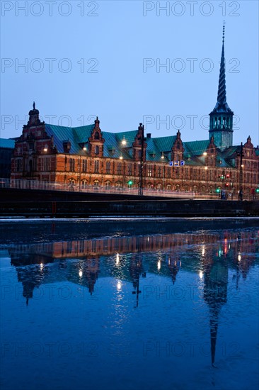 Denmark, Copenhagen. View over canal towards Copenhagen Stock Exchange and Christiansborg Castle. Photo : Henryk Sadura