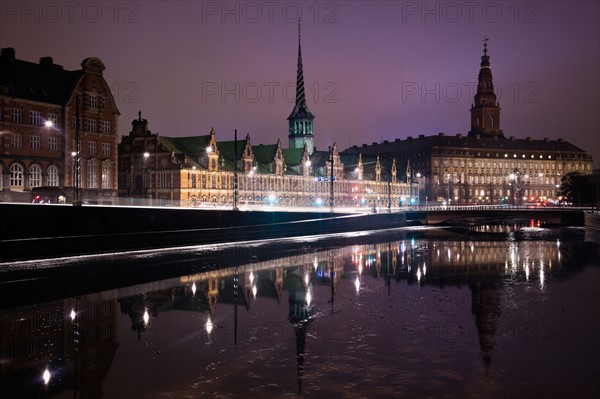 Denmark, Copenhagen. View over canal towards Copenhagen Stock Exchange and Christiansborg Castle. Photo : Henryk Sadura