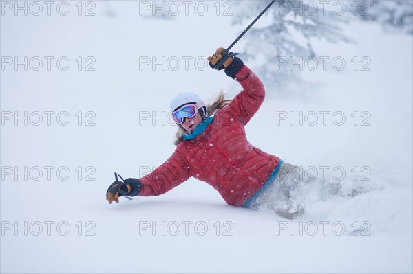 USA, Montana, Whitefish. Woman skiing powder . Photo : Noah Clayton
