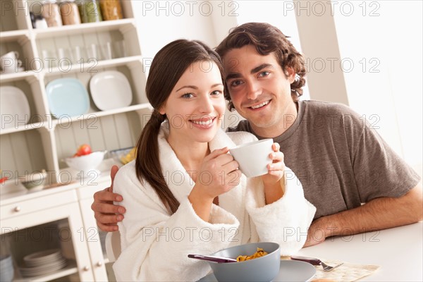 Portrait of young couple at breakfast. Photo : Rob Lewine