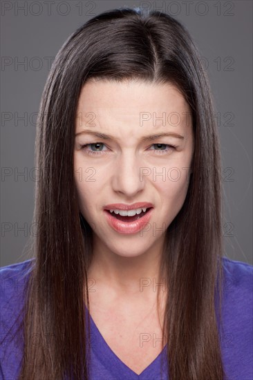 Studio shot of confused woman. Photo : Rob Lewine