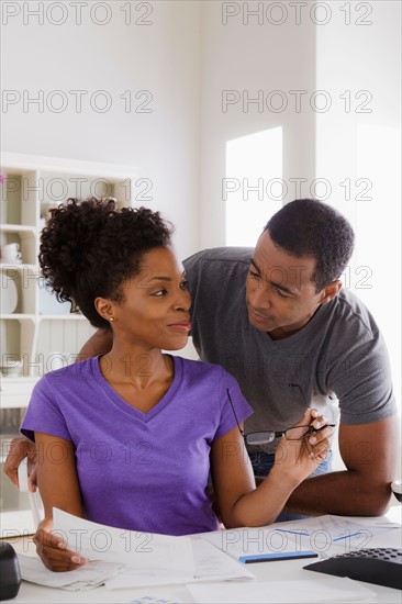 Couple doing finances together. Photo : Rob Lewine