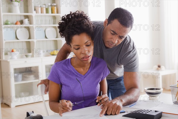 Couple doing finances together. Photo : Rob Lewine