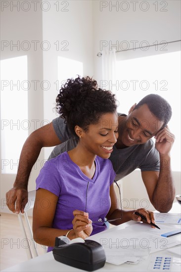 Couple doing finances together. Photo : Rob Lewine