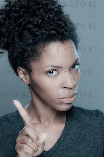 Studio shot of displeased young woman. Photo : Rob Lewine