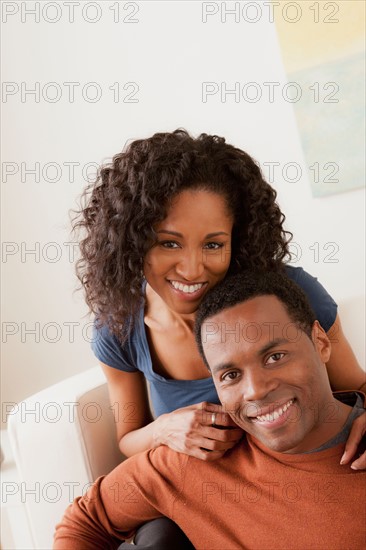 Smiling mid adult couple together. Photo : Rob Lewine