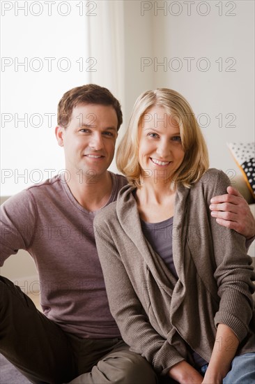 Portrait of smiling mid adult couple. Photo : Rob Lewine