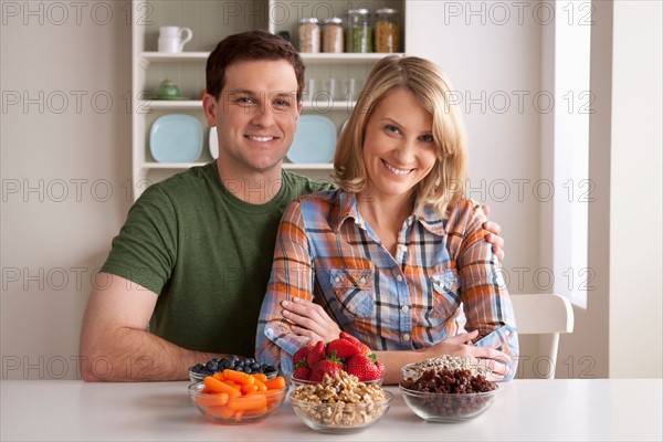 Portrait of mid adult woman with healthy fruits. Photo : Rob Lewine