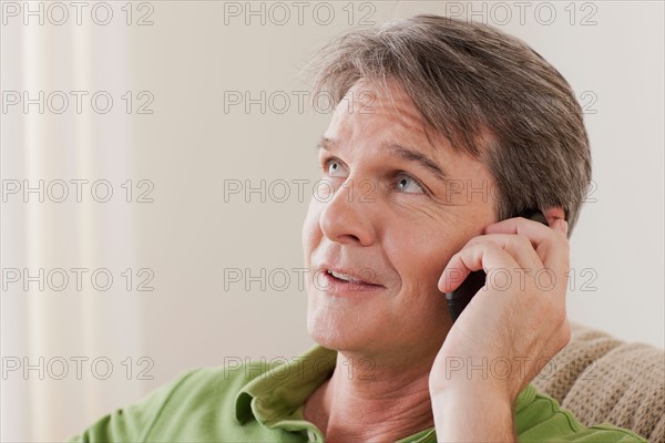 Man talking on phone. Photo : Rob Lewine