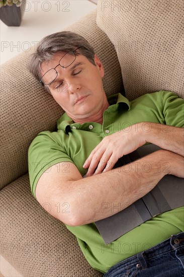 Man napping on couch. Photo : Rob Lewine