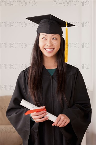 Portrait of graduated young woman. Photo : Rob Lewine