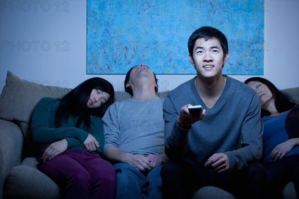 Family watching TV. Photo : Rob Lewine