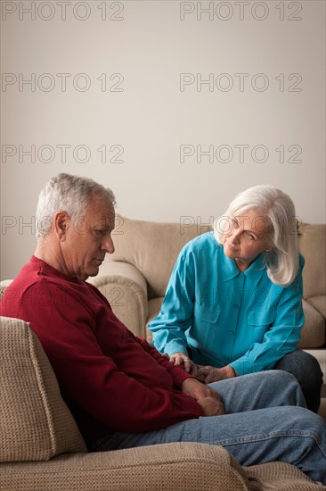 Woman comforting sad senior man. Photo : Rob Lewine