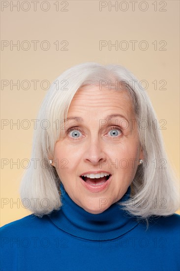 Studio shot of surprised senior woman. Photo : Rob Lewine