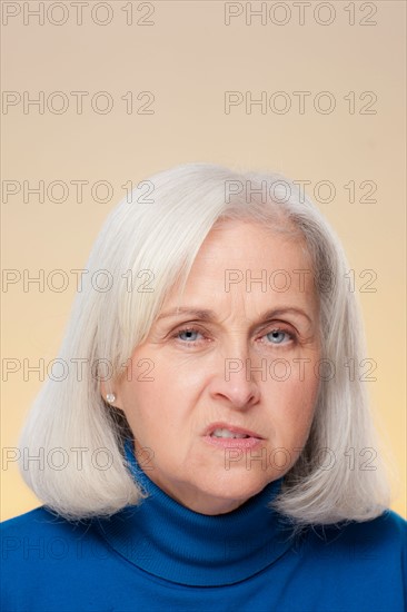 Studio shot of displeased senior woman. Photo : Rob Lewine