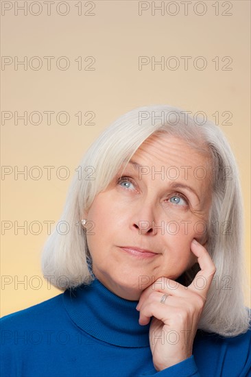 Studio shot of thoughtful senior woman. Photo : Rob Lewine