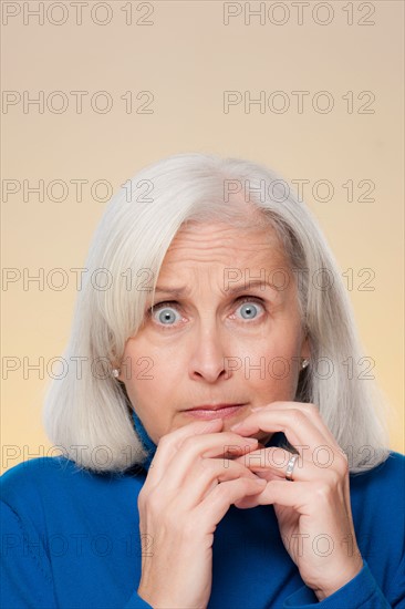Studio shot of worried senior woman. Photo : Rob Lewine