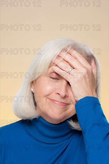 Studio shot of surprised senior woman. Photo : Rob Lewine