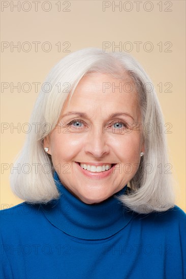 Studio shot of smiling senior woman. Photo : Rob Lewine