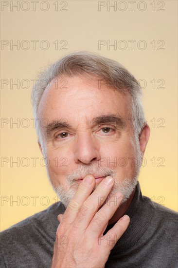 Studio shot of thoughtful senior man. Photo : Rob Lewine