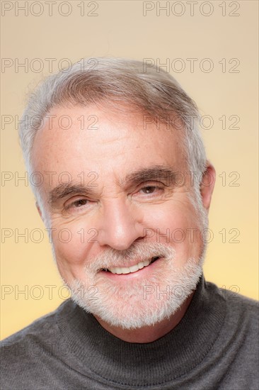 Studio shot of smiling senior man. Photo : Rob Lewine