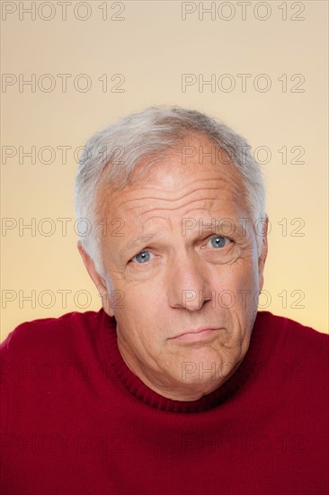 Studio shot of confused senior man. Photo : Rob Lewine