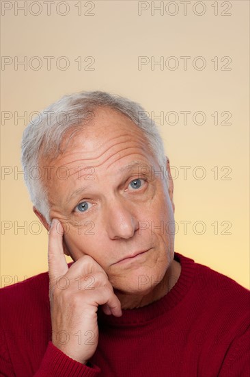 Studio shot of thoughtful senior man. Photo : Rob Lewine