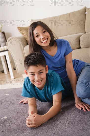 Sister and brother smiling. Photo : Rob Lewine
