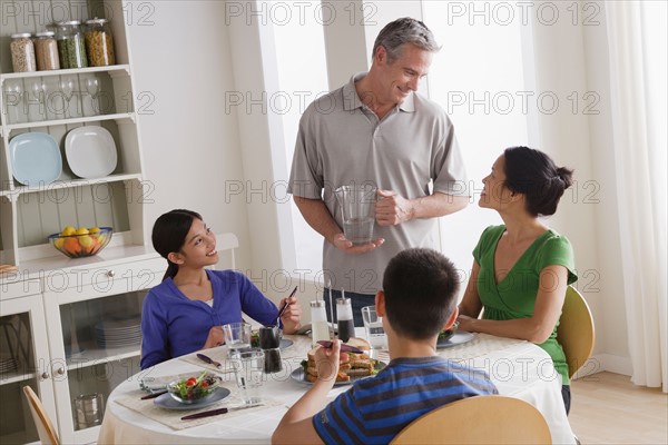 Family having breakfast together. Photo : Rob Lewine