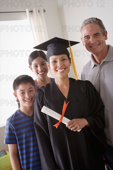 Family celebrating mother's graduation. Photo : Rob Lewine